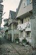 Oppenau: Blick in eine Gasse - Wohnhaus mit trocknender Wäsche vor den Fenster 1958